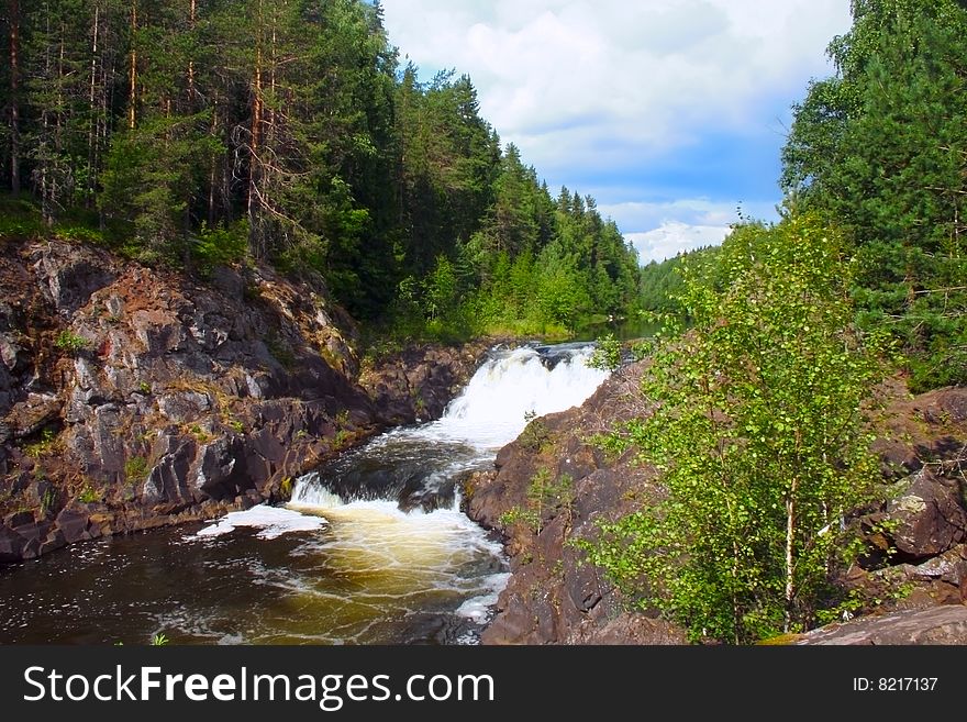 Summer kind on the well-known waterfall of Kivach to Kareliyas, a photo it is made in the afternoon in solar weather. Summer kind on the well-known waterfall of Kivach to Kareliyas, a photo it is made in the afternoon in solar weather