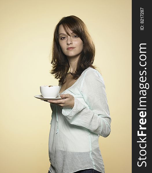 Laughing woman with long brown hair and a cup of coffee 01. Laughing woman with long brown hair and a cup of coffee 01