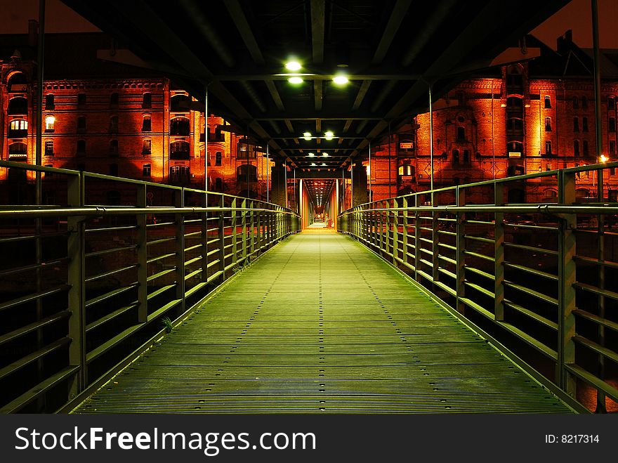 Illuminated foot bridge in the Speicherstadt, Hamburg, Germany