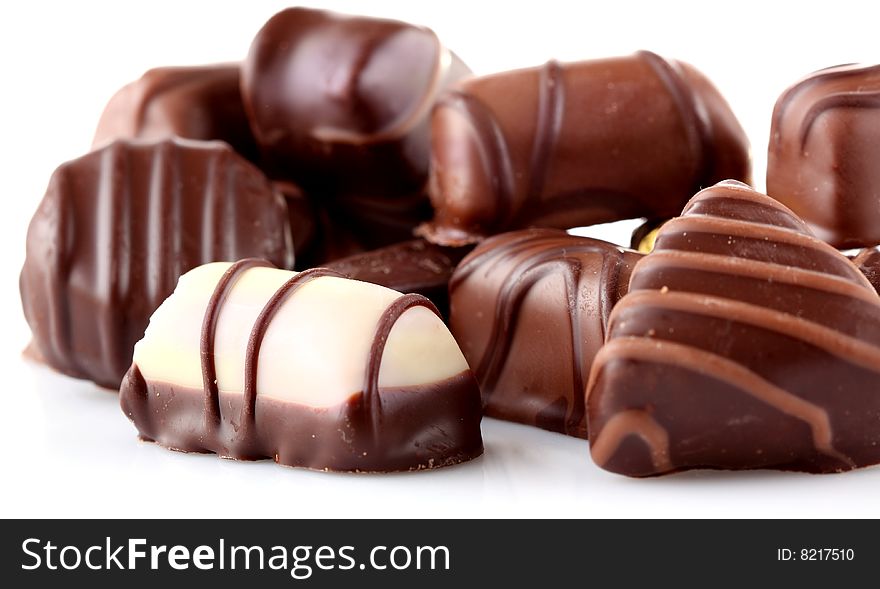 Assorted chocolates isolated on white background