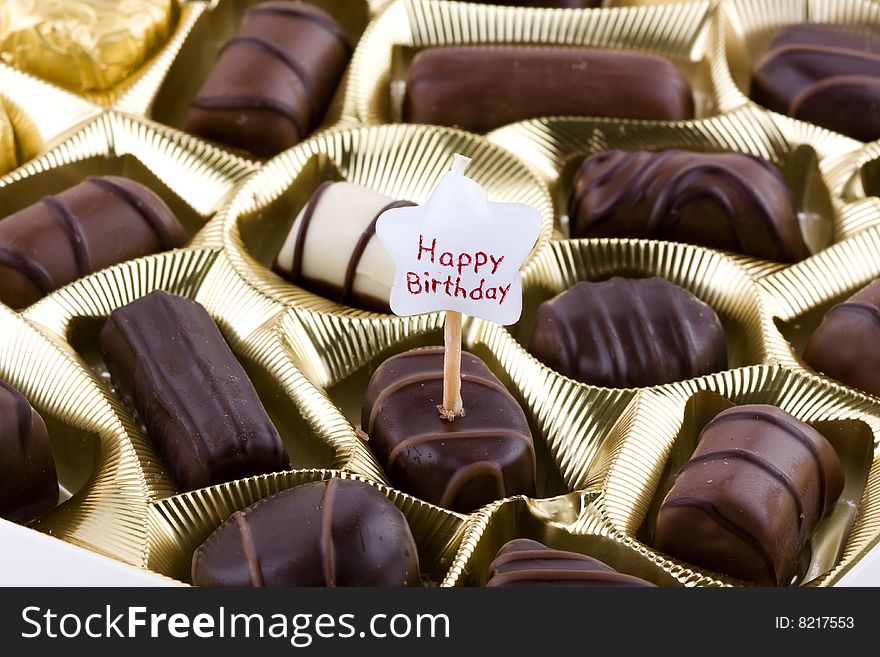 Assorted chocolates isolated on white background