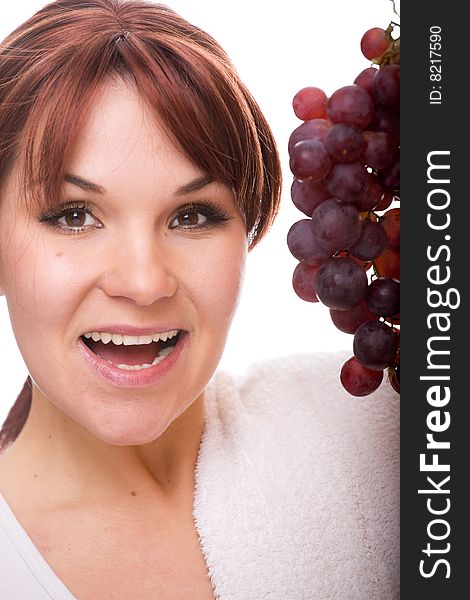 Attractive woman with grapes. over white background