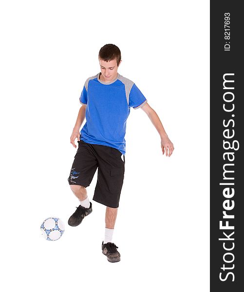 Happy teenager playing football. over white background. Happy teenager playing football. over white background