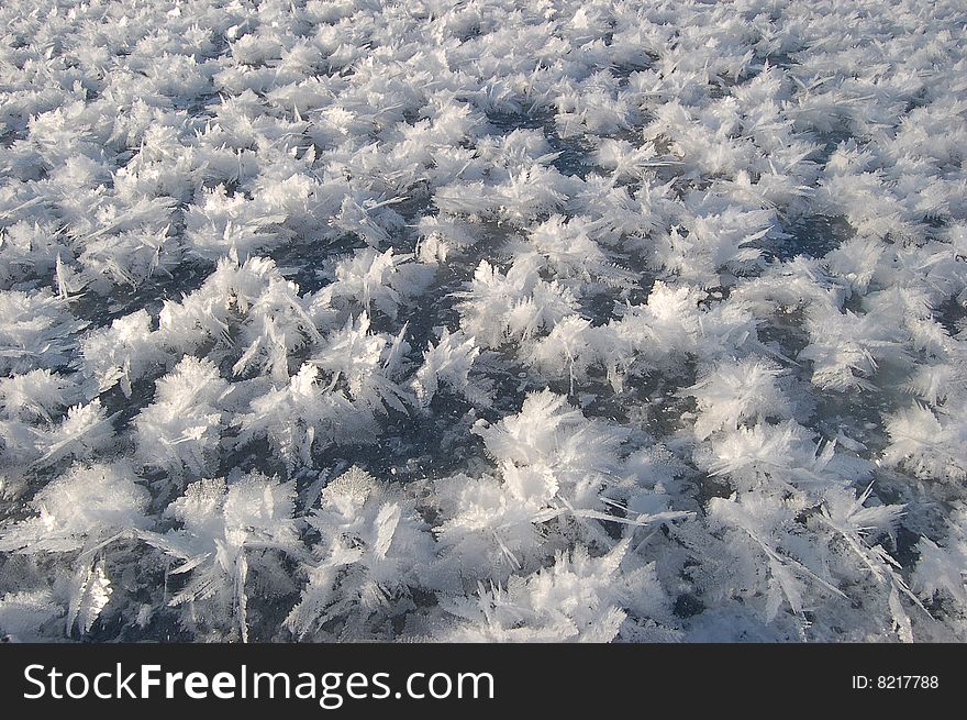 Unusual snowflake on ice. texture