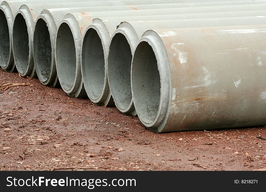 Some concrete pipes lined up
