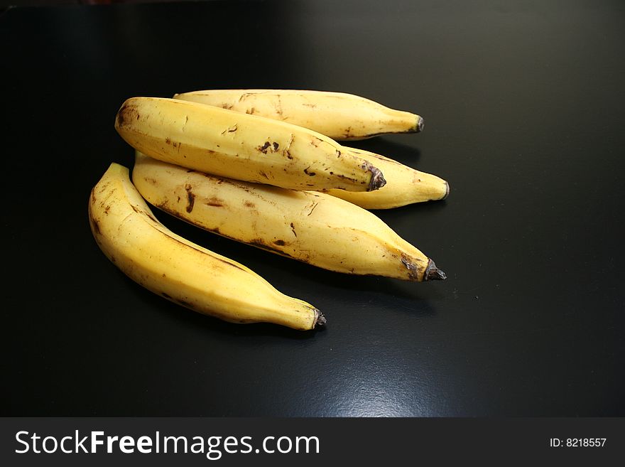 Big Indian bananas on a dark background