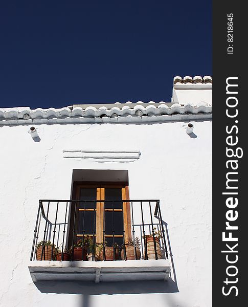 Balcony with plants in the village of Frigiliana in Spain. Balcony with plants in the village of Frigiliana in Spain.