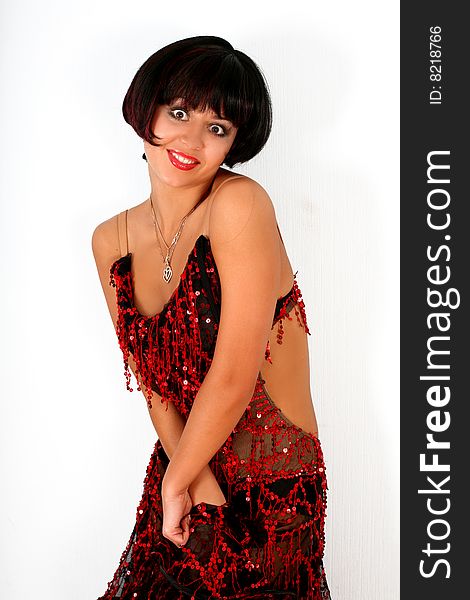 Lovely brunette latin dancer in red dress