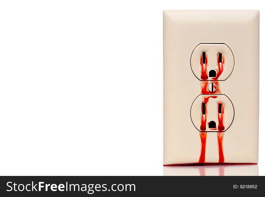 A bleeding electrical outlet on white