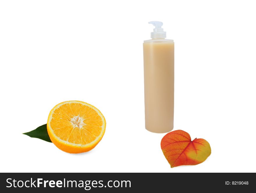 Shampoo with orange and leaf.