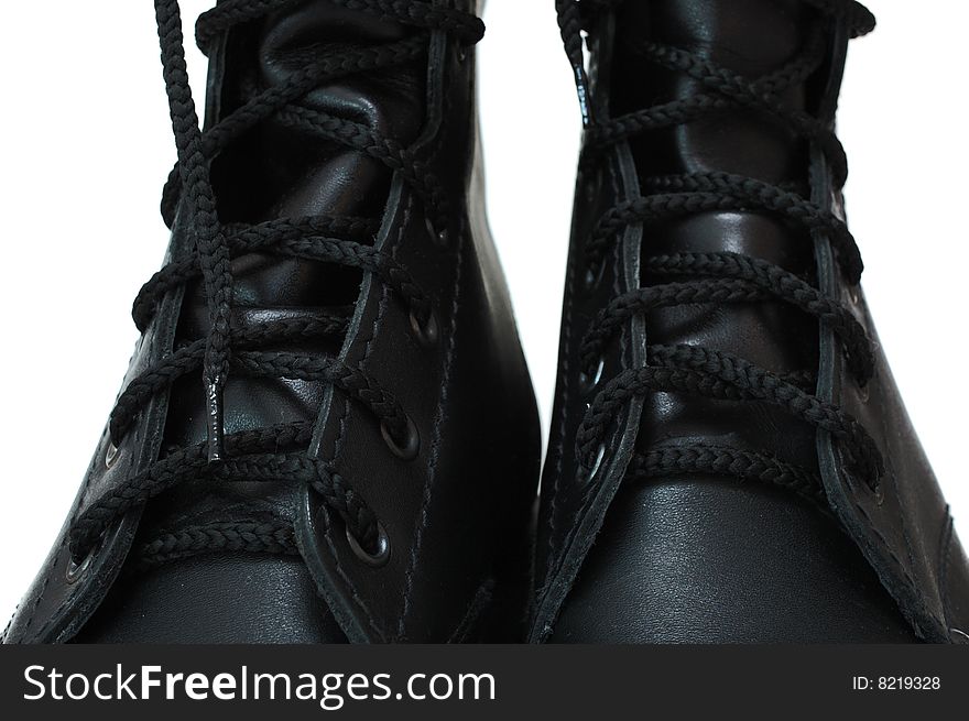 Two black leather army boots.