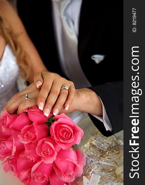 Bride & Groom wearing wedding rings