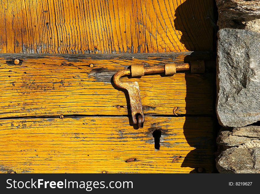 Locking of an old wooden door. Locking of an old wooden door