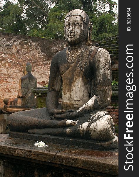 Four statues of seated Buddha are located in Vatadage ancient house of relic in Polonnaruwa, Sri Lanka. Two of them are shown in the picture. Four statues of seated Buddha are located in Vatadage ancient house of relic in Polonnaruwa, Sri Lanka. Two of them are shown in the picture.