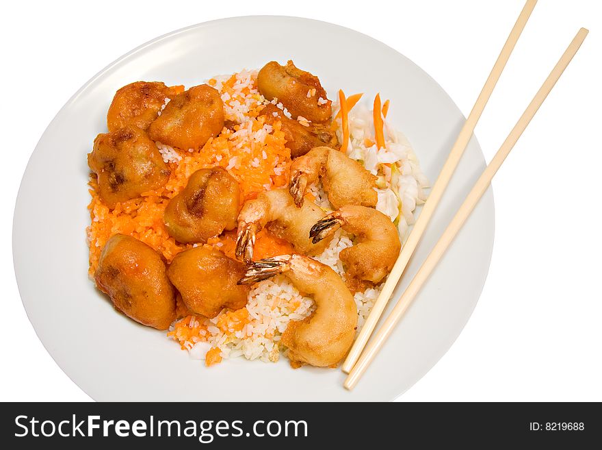 Plate of sweet and sour pork and shrimp on fried rice isolated on white with chopsticks. Plate of sweet and sour pork and shrimp on fried rice isolated on white with chopsticks
