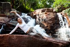 Young Woman Relaxing By The Waterfall Stock Image Young Woman Relaxing By The Waterfall Stock Image