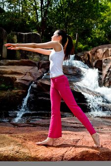 Young Woman Relaxing At The Waterfall Royalty Free Stock Photography Young Woman Relaxing At The Waterfall Royalty Free Stock Photography