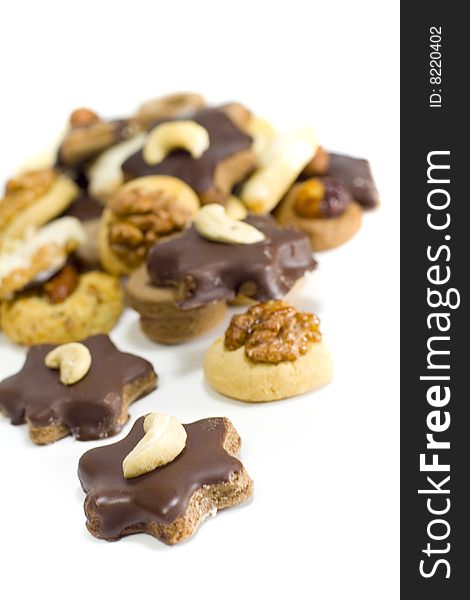 Cookies with chocolate and nuts closeup on white background