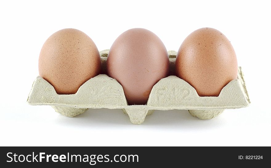 Strip of three eggs on egg cartons
