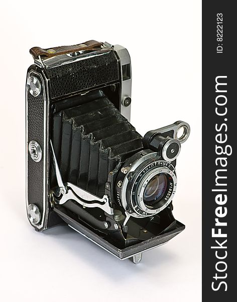 Old photo camera on white background