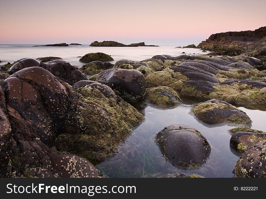 Beautiful ocean cove taken in Anna Bay, NSW, Australia during twilight conditions.