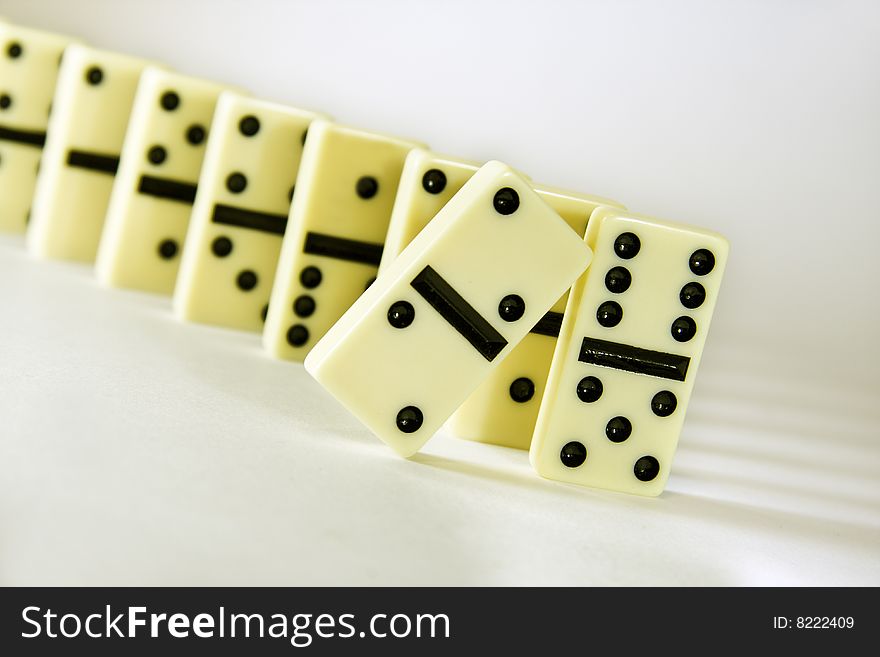 Dominoes diagonal white background, concept