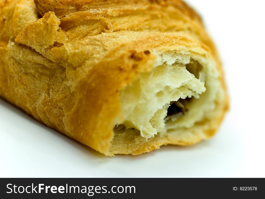 Fresh delicious croissant isolated on a white background.