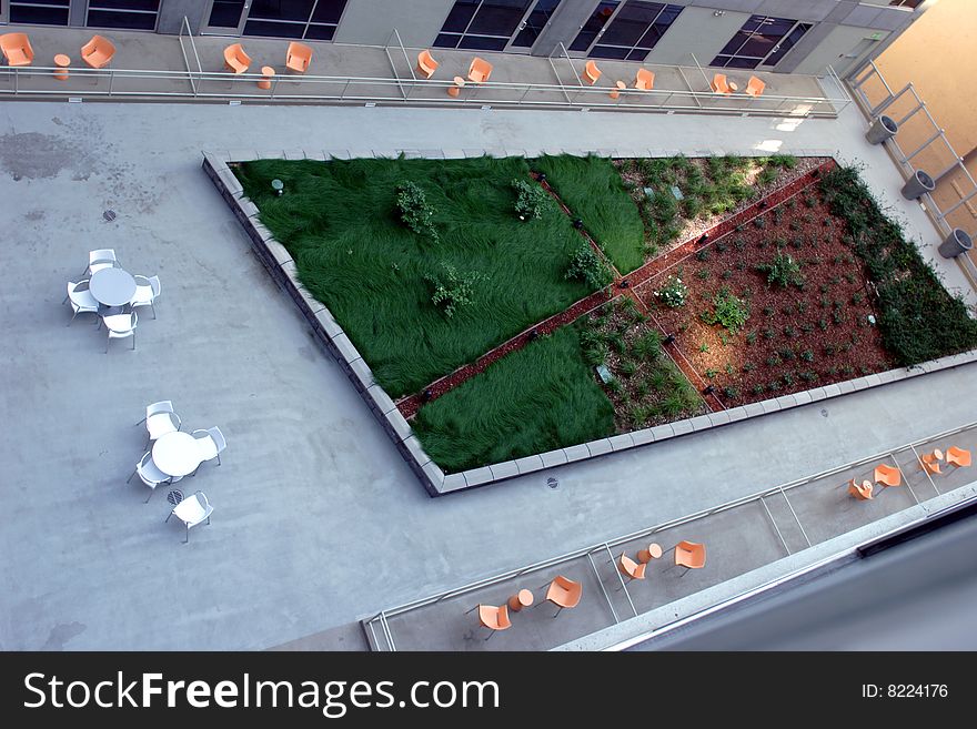 A modern loft courtyard with tables and chairs