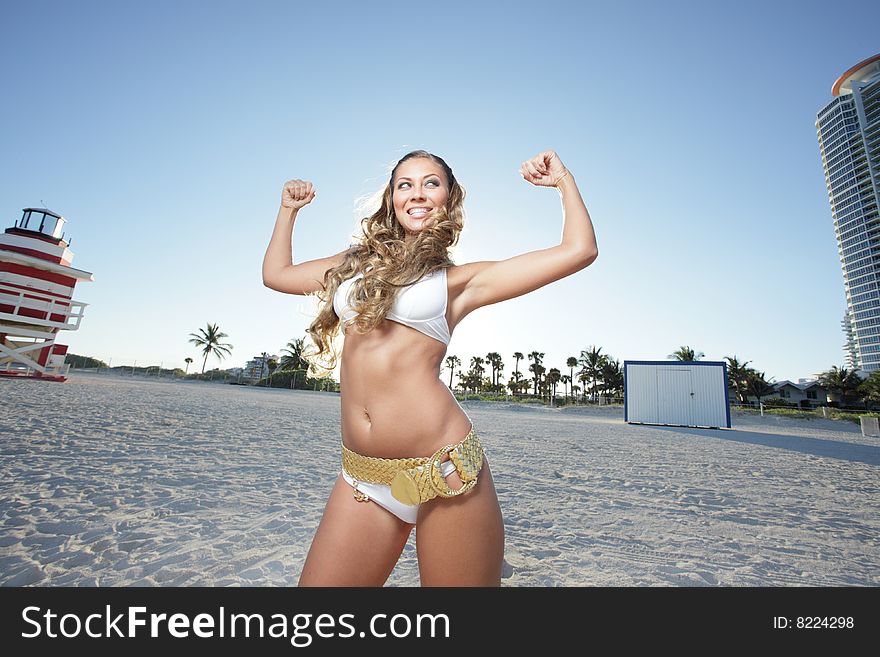 Woman On The Beach Flexing