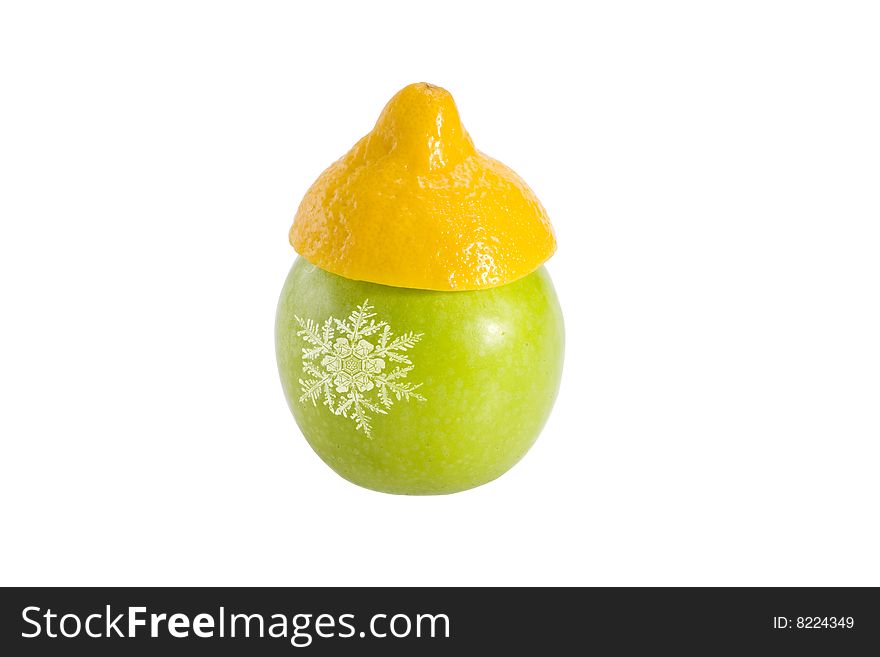 Green fresh apple in a yellow hat from a lemon with a snowflake. Green fresh apple in a yellow hat from a lemon with a snowflake