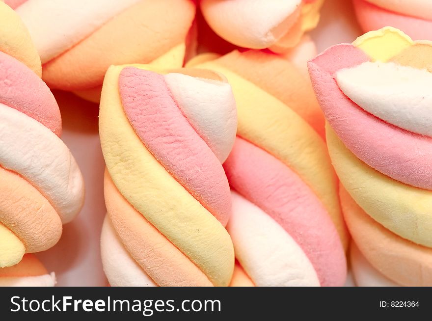 The colored sweet marsh mallows. The colored sweet marsh mallows