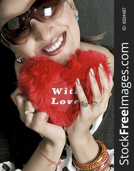 Girl holding a red heart. Girl holding a red heart.