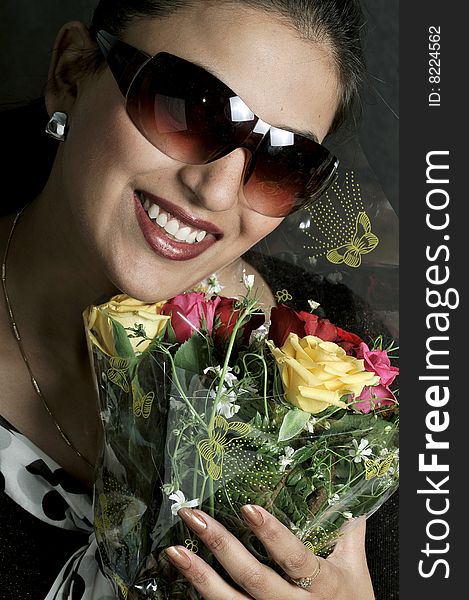 Girl with roses in studio.