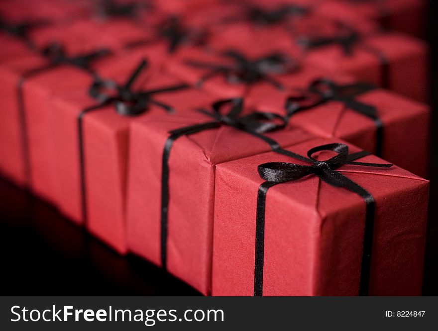 Many red gift boxes on black background