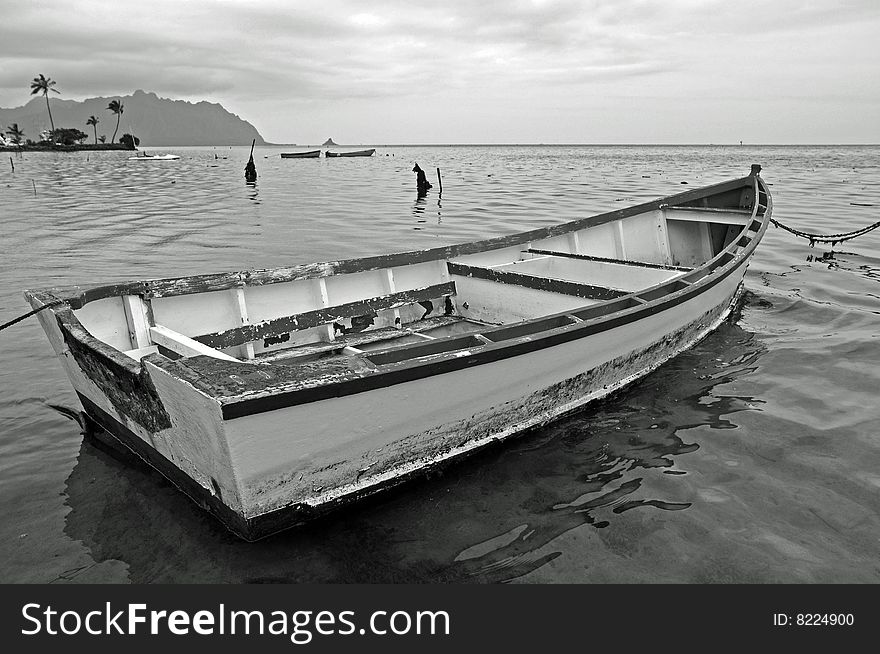 This is a black and white picture of a harbor on Kaneohe Bay, Hawaii. This is a black and white picture of a harbor on Kaneohe Bay, Hawaii.