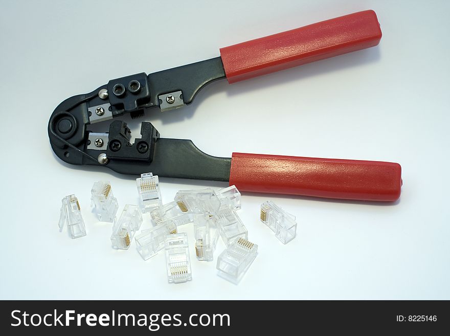 Network rj45 connectors and red crimper. Network rj45 connectors and red crimper