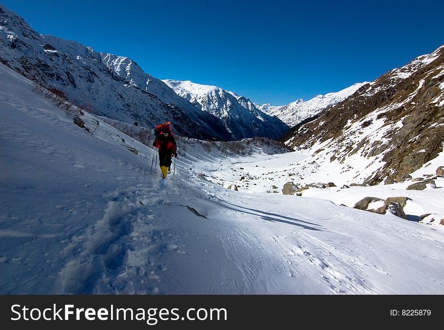 Hikers go up in mountains