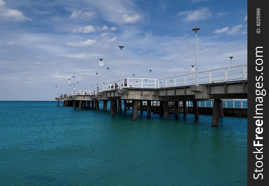 A long pier on a bright day
