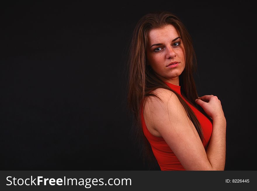 Young attractive girl in the soft studio light. Young attractive girl in the soft studio light.