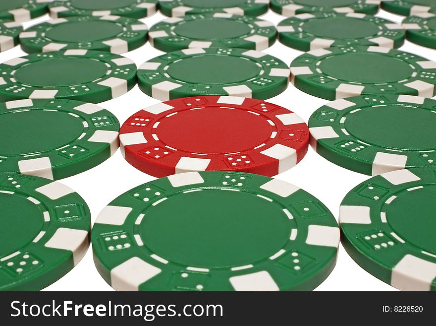 Green and one red poker chips isolated on white background