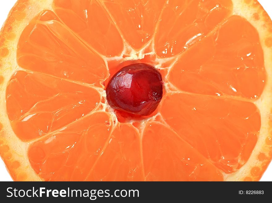 Grain of pomegranate is in a juicy mandarine.