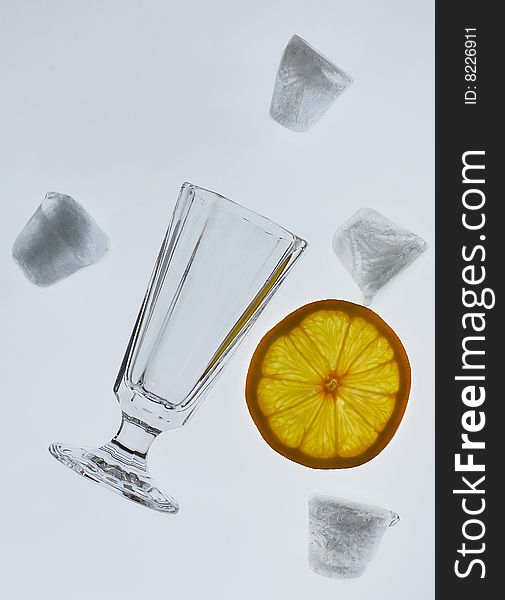 Glass is about ice and lemon