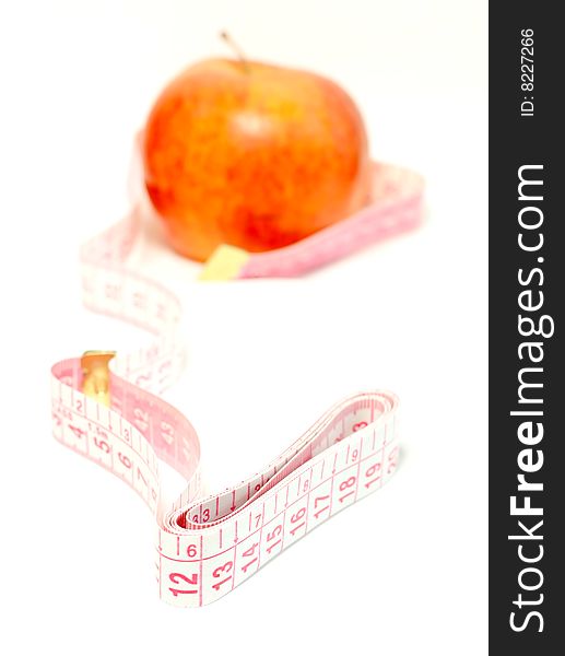 Diet, apple and measuring tape isolated on white background