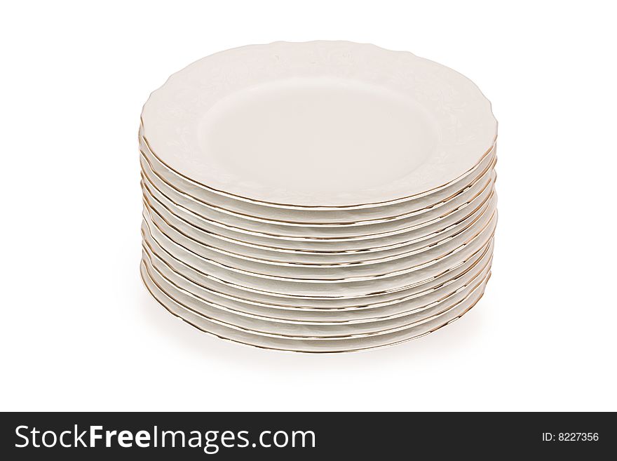 Stack of plain dinner plates isolated on white background