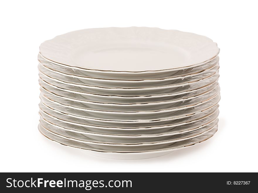 Stack of plain dinner plates isolated on white background