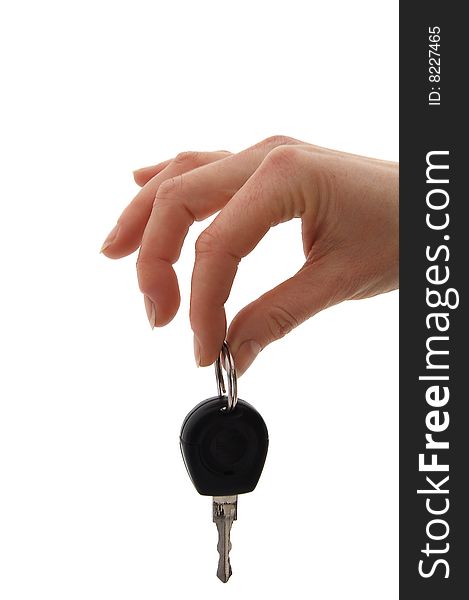 Hand holding metallic key. isolated