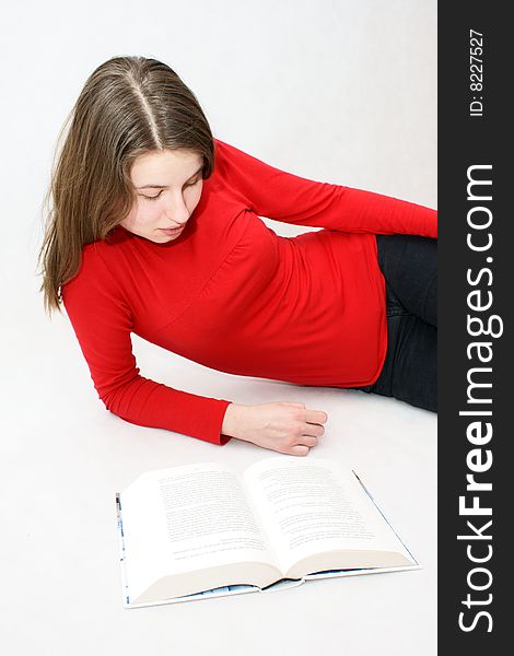 Young beautifful girl who read a book in isloated white background