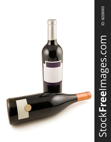 Two bottles of red wine on a white background. Two bottles of red wine on a white background
