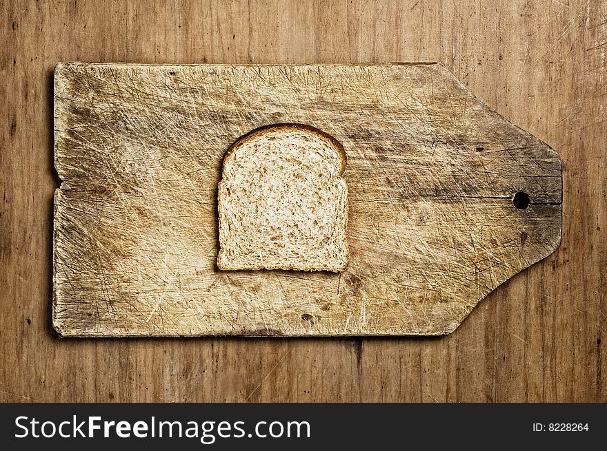 Slice of wholemeal bread on a table. Slice of wholemeal bread on a table.