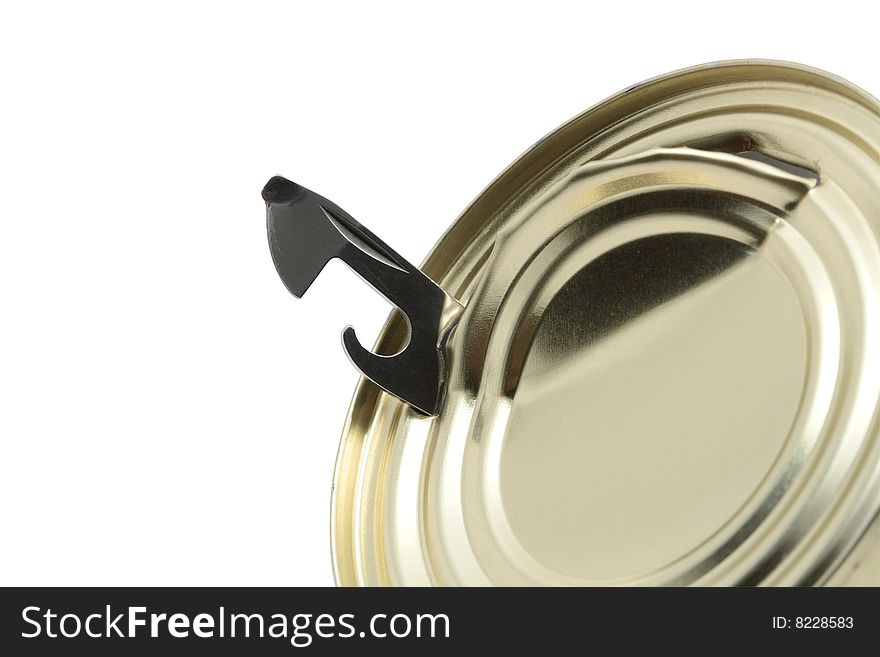 Close-up of can opener inside tin isolated on white background. Close-up of can opener inside tin isolated on white background